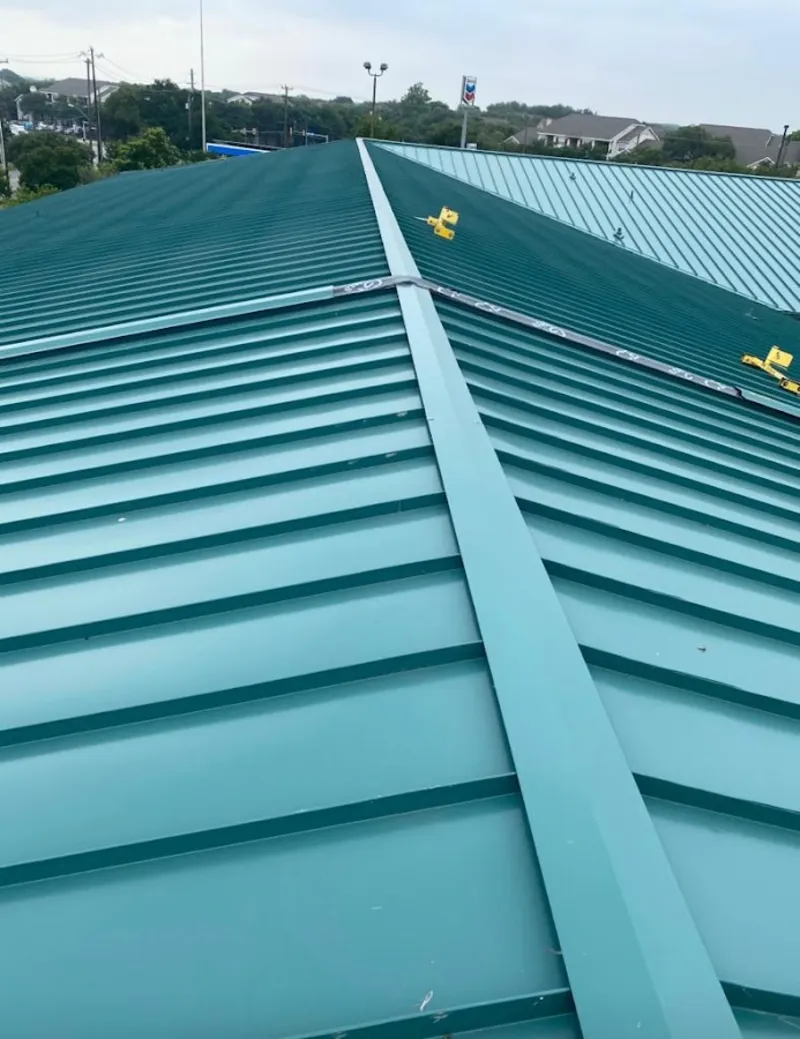 Green commercial metal roof ridge and valley for Metal Roof Repair in Canfield