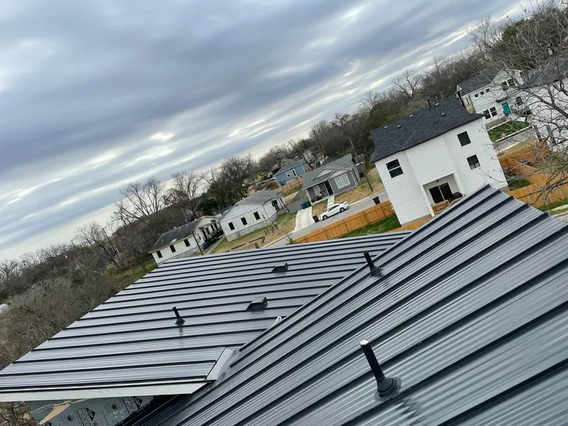 Standing seam metal roof panels with vents for Skylight Repair in Canfield